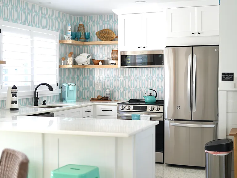 Newly remodeled Kitchen with marble countertops and wood cabinets.
