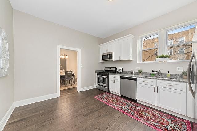 Kitchen and eating area. Potential area to add your bar.