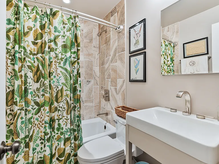 Third full size bathroom with a shower / tub combo. We provide all towels during your 30+ day stay.