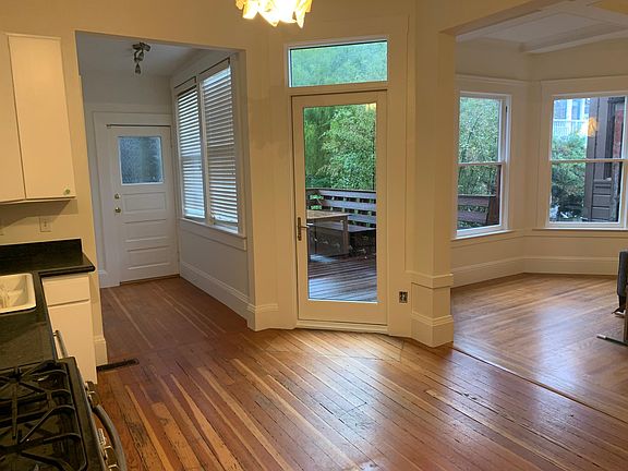 Standing in the kitchen, looking out to the deck on a rainy day.