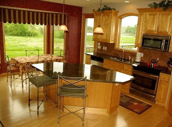 Dining Rm. and Kitchen w/ SS Appl, granite tops, large island, and walk-in pantry