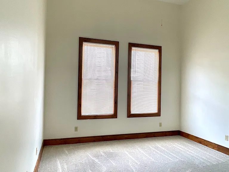 Bedroom #2. Note all trim has been updated to white.