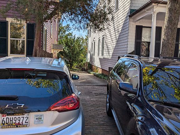 Driveway, fits two cars in the front and 3-4 cars lined up down the side