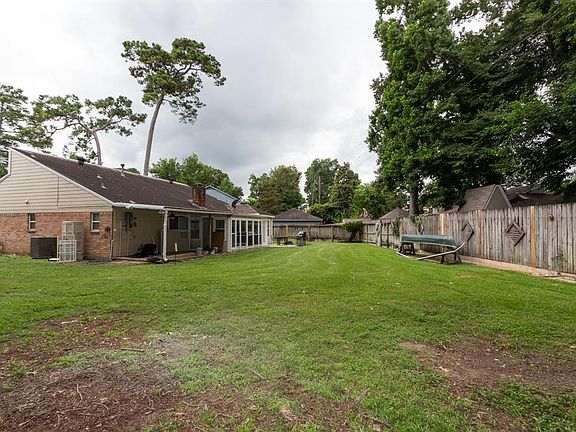 LARGE yard...enclosed porch and also a covered porch...pad area for BBQ