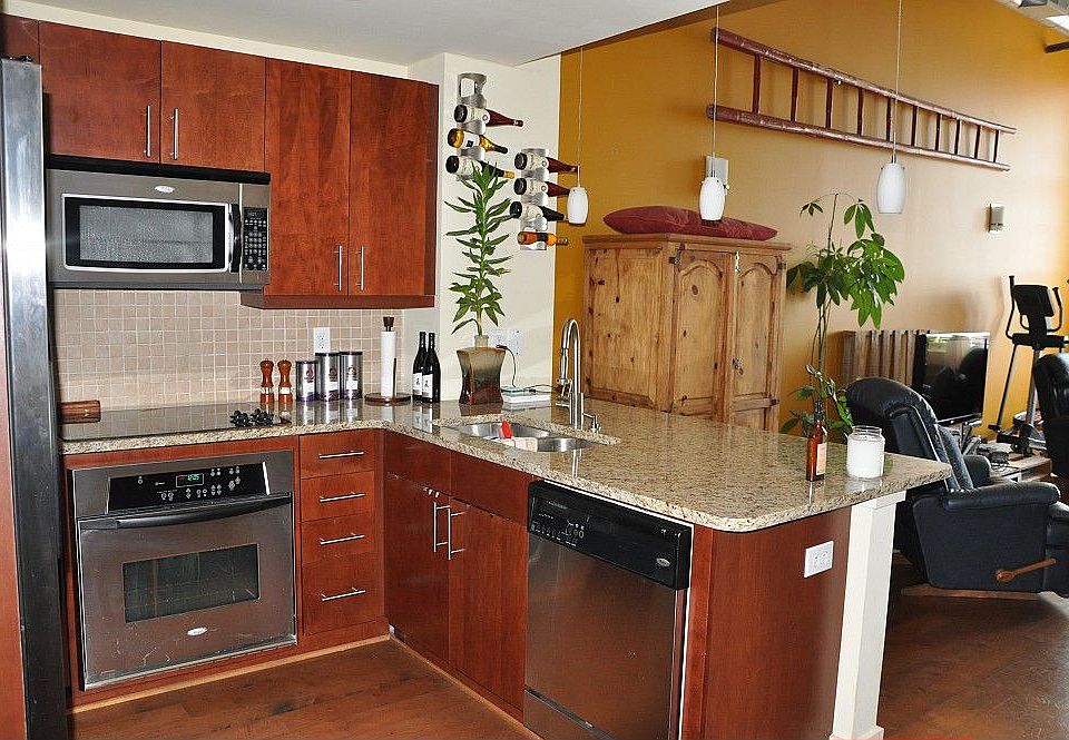 Spacious modern 2-story loft with 20-foot ceilings and distressed hardwood floors