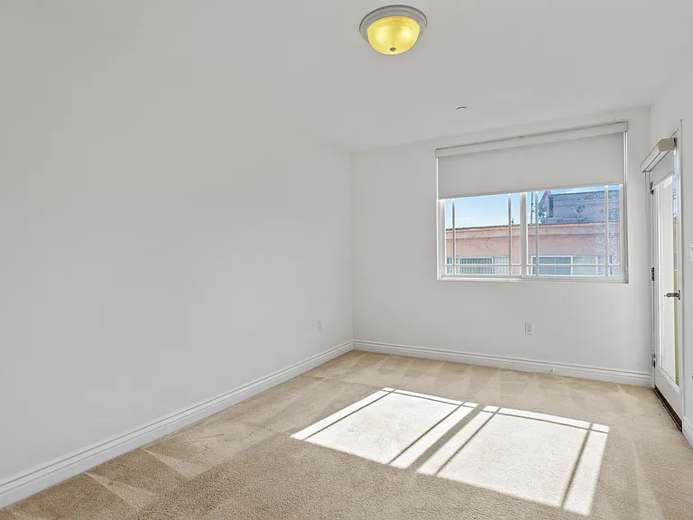 Bedroom with Patio and Windows