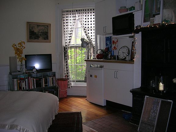Same space, showed as lived in by a prior tenant. These are not the same curtains for sale by current tenant, which are white and floor length.