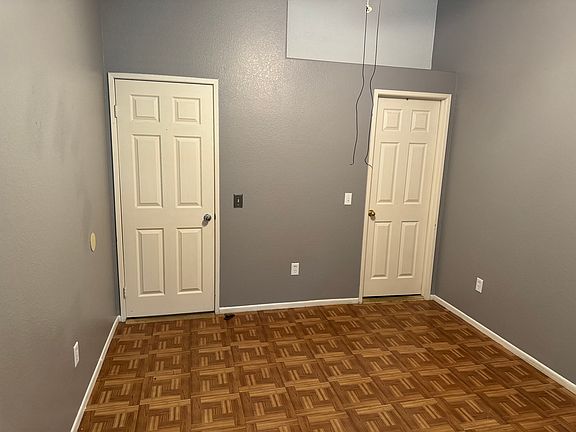 Room with closet and attached bathroom
