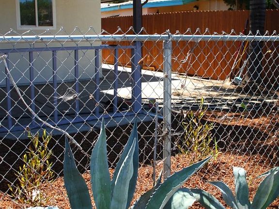 Carport, new fence shown in background