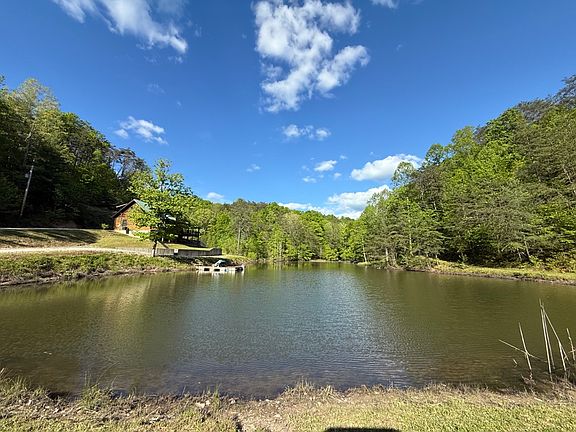 Beautiful view of the pond and cabin from the dam of the pond
