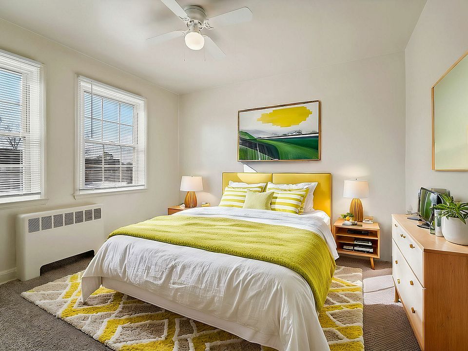 Immerse yourself in the warmth of this sunlit bedroom, combining comfort with stylish design.