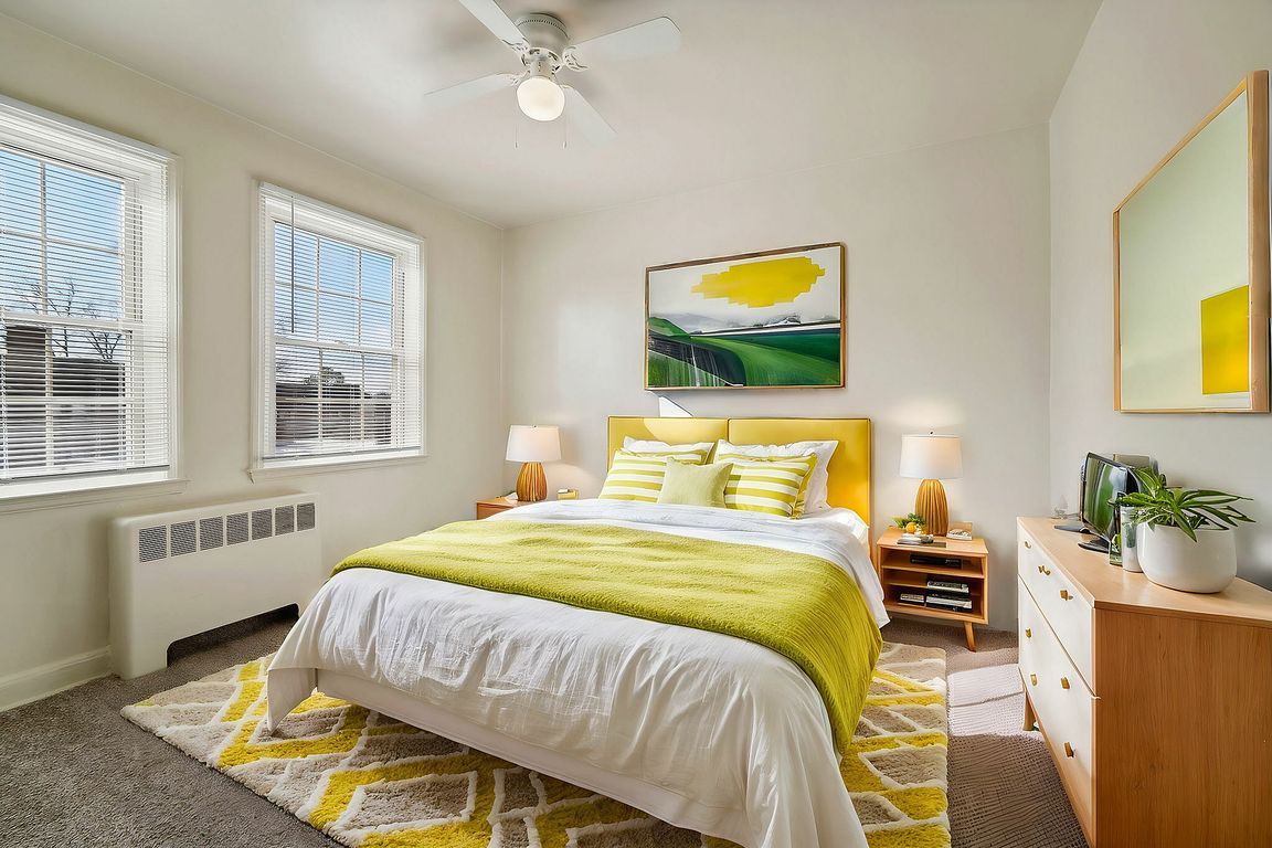 Immerse yourself in the warmth of this sunlit bedroom, combining comfort with stylish design.