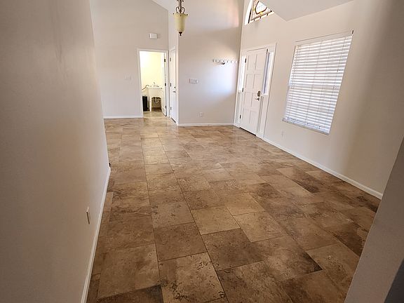 Dining area, door to garage and laundry room.