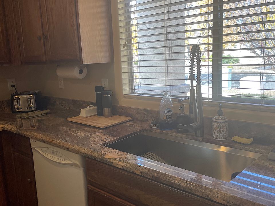 Kitchen stainless steel large sink with garage disposal, dishwasher and new granite countertop