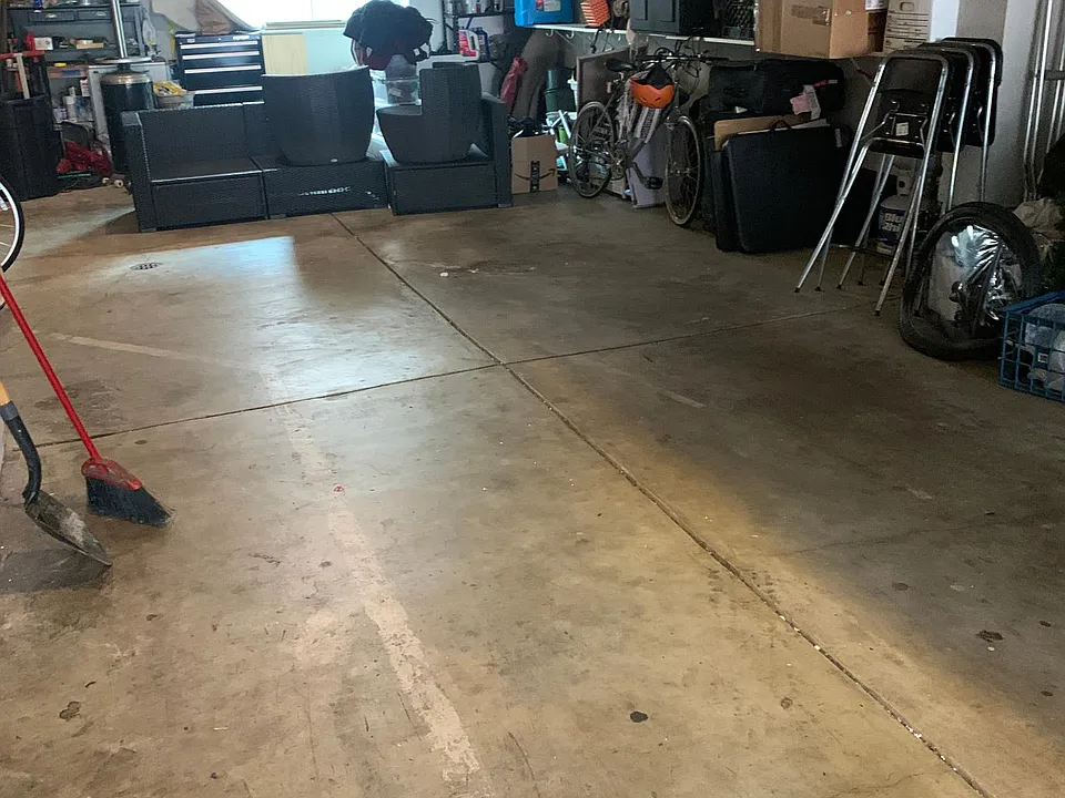 Garage with tandem parking and communal storage.