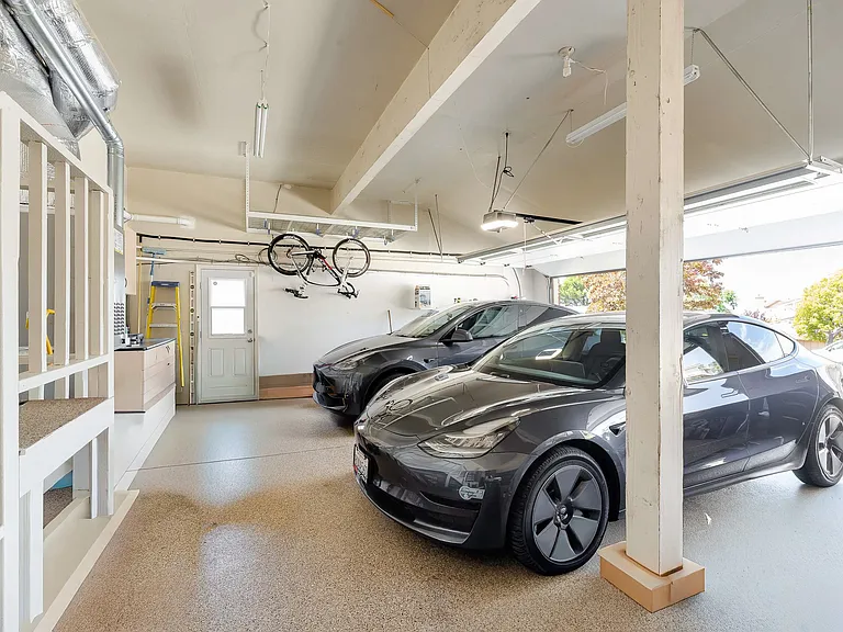 3-car garage with EV charging outlet and bike rack