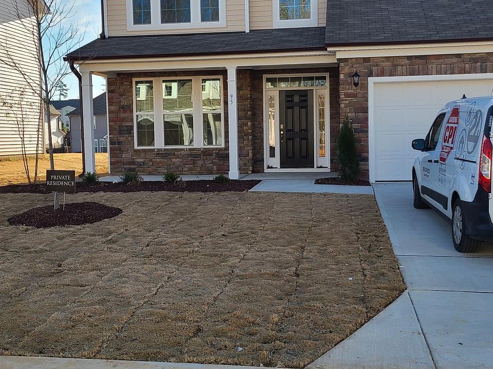 Front Elevation. Very beautiful light brown stone with a small porch for seating arrangements.