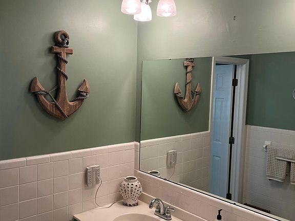 Bathroom with connecting; tub/shower.