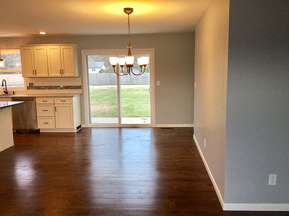 Dining Area - open concept with plenty of space for a large table and gatherings - new slider door leads to the patio and backyard area.