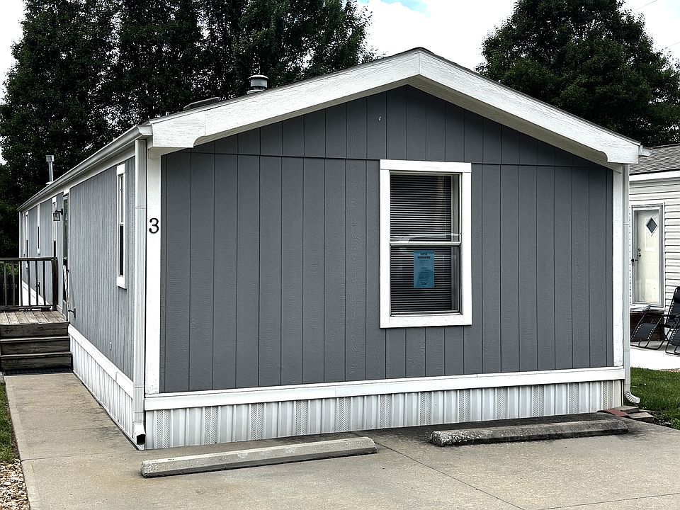 Mobile Home #3 - Blue Info Sheet on Front Window. Has 2 parking spaces.