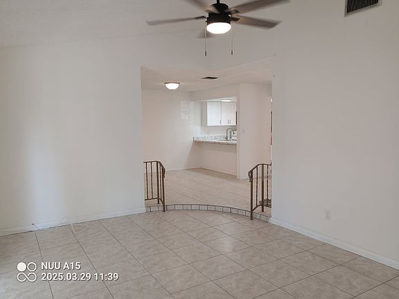 View from Living room to fully equipped, updated kitchen.