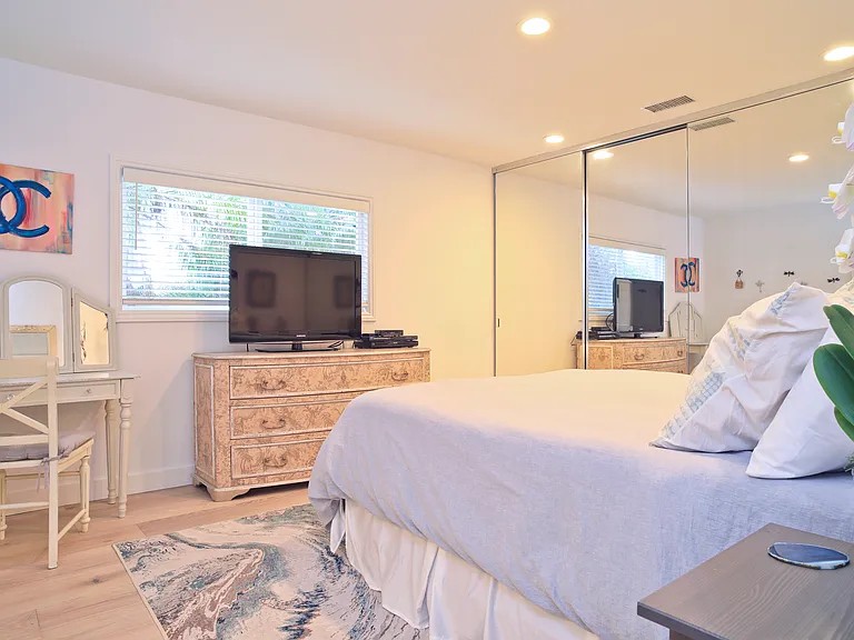 Main Floor 2nd bedroom. King size bed and lots of closet space!