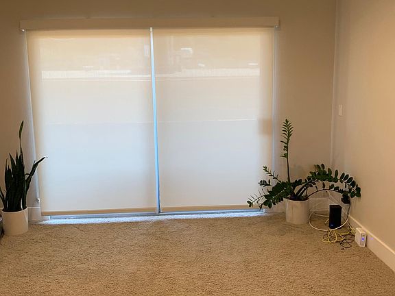 Living area with solar shades & recessed lighting