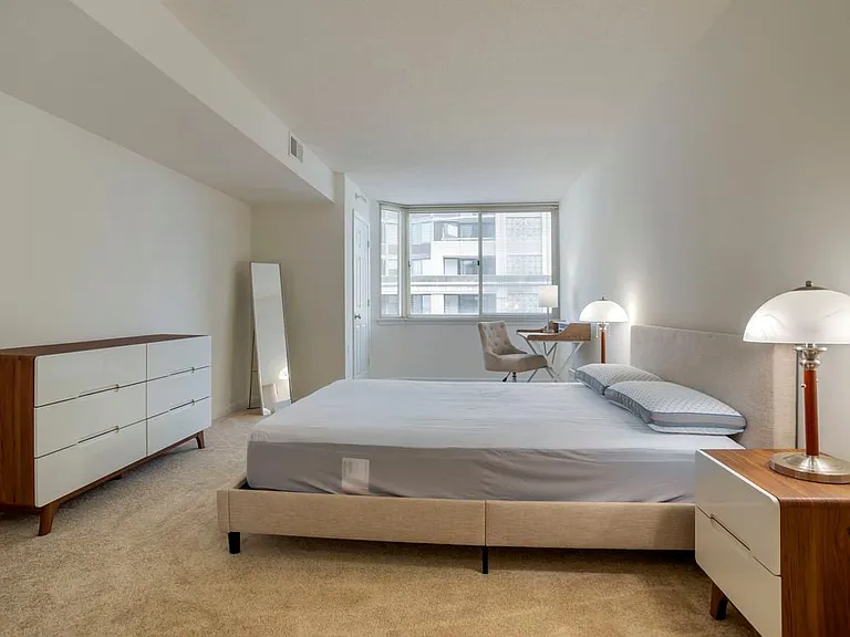 Furnished+ apartment homes feature queen bed with mattress, two pillows, dresser, nightstands, lamp, and mirror. (Representative Image exact items and style of furnishings may vary)