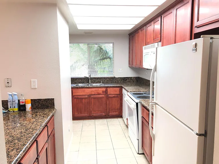 Upgraded Kitchen with all the appliances ( Refrigerator, cooking range, oven, microwave, dish washer, double sink) . With pantry and lots of extra cabinets. Granite counter top.