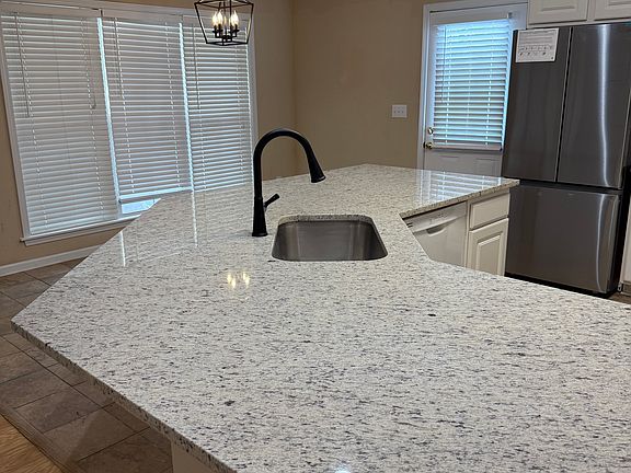 Huge natural stone island, Single bowl undermount sink, Modern faucet