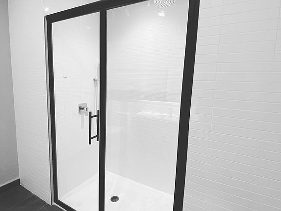 Master bath features custom built vanity with LED lighting, linen closet and walk in shower with rain shower head with handheld.