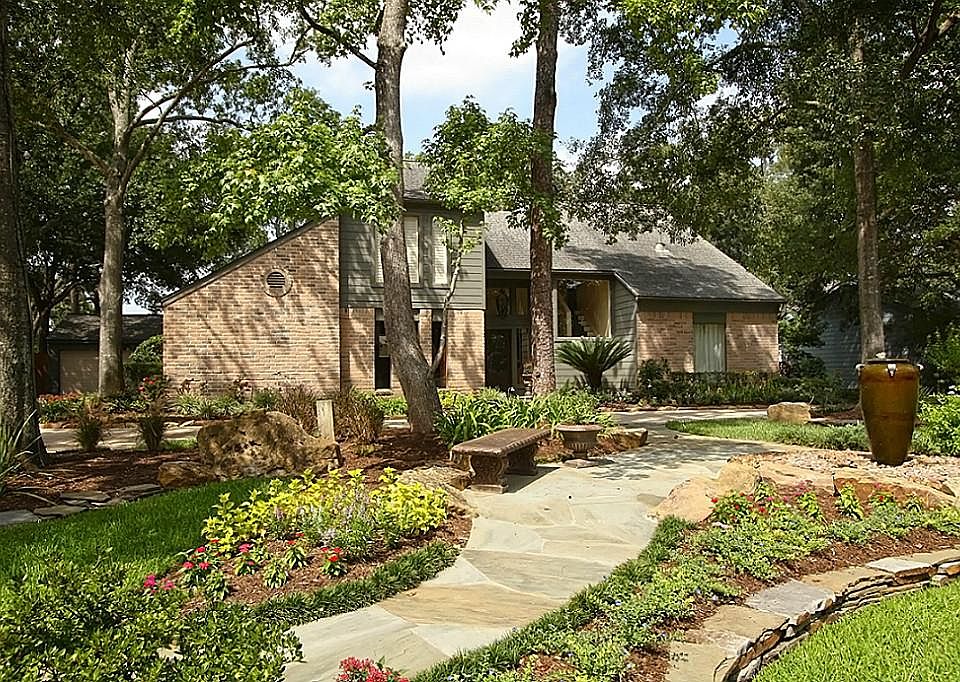 Professional landscaping  and circular drive welcome you
