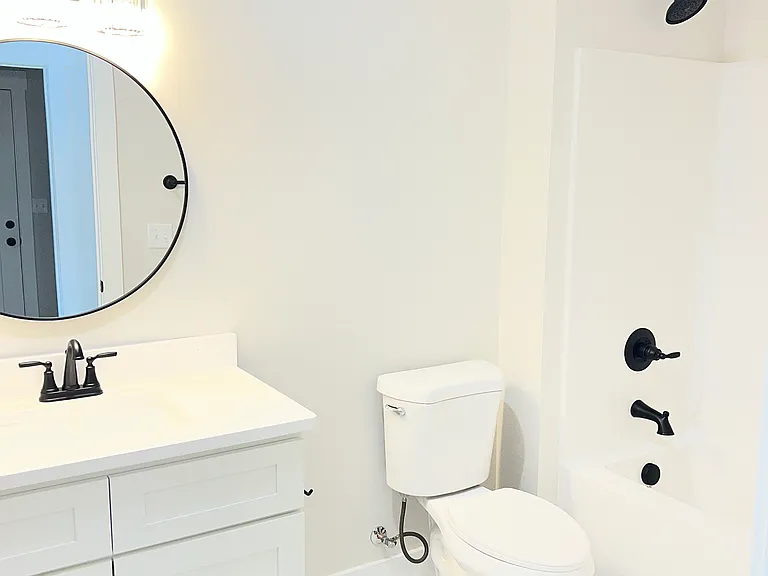 Hall bathroom with tub and shower