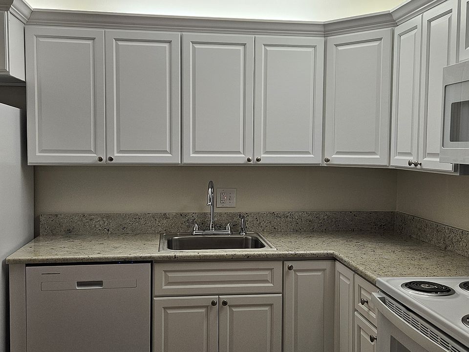 Fully renovated kitchen with new appliances, cabinets and countertops.