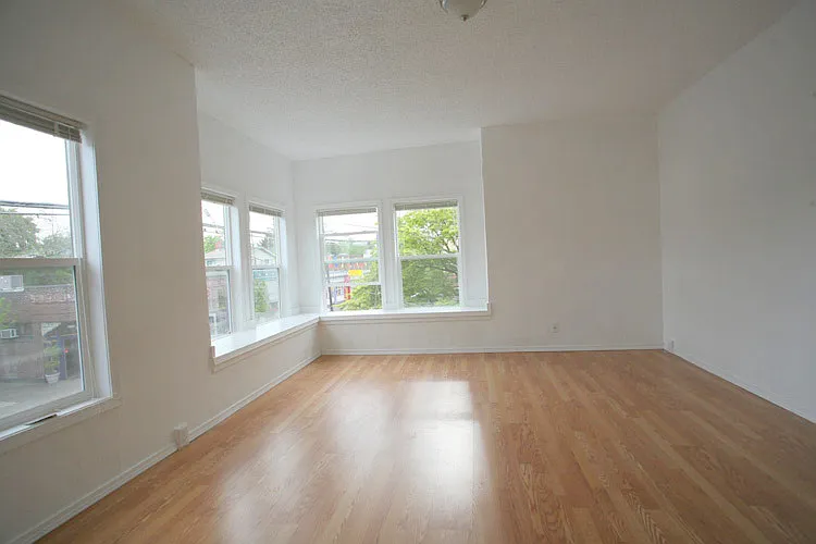 apt. 2 living area with corner window seat