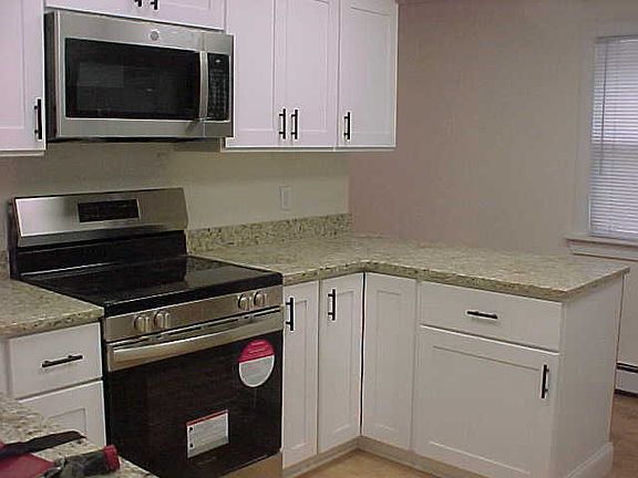 New cabinets, electric stove, microwave