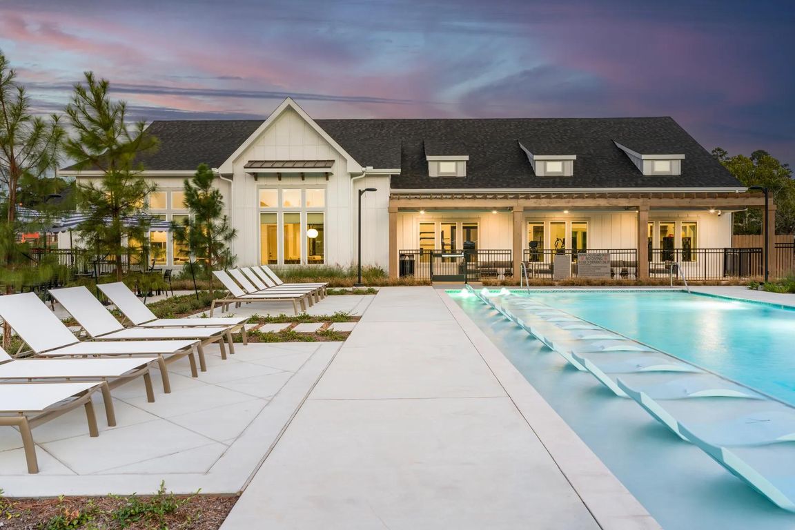 Resort-style pool with spacious sundeck at Beckett West Fork apartment homes in Conroe, TX.