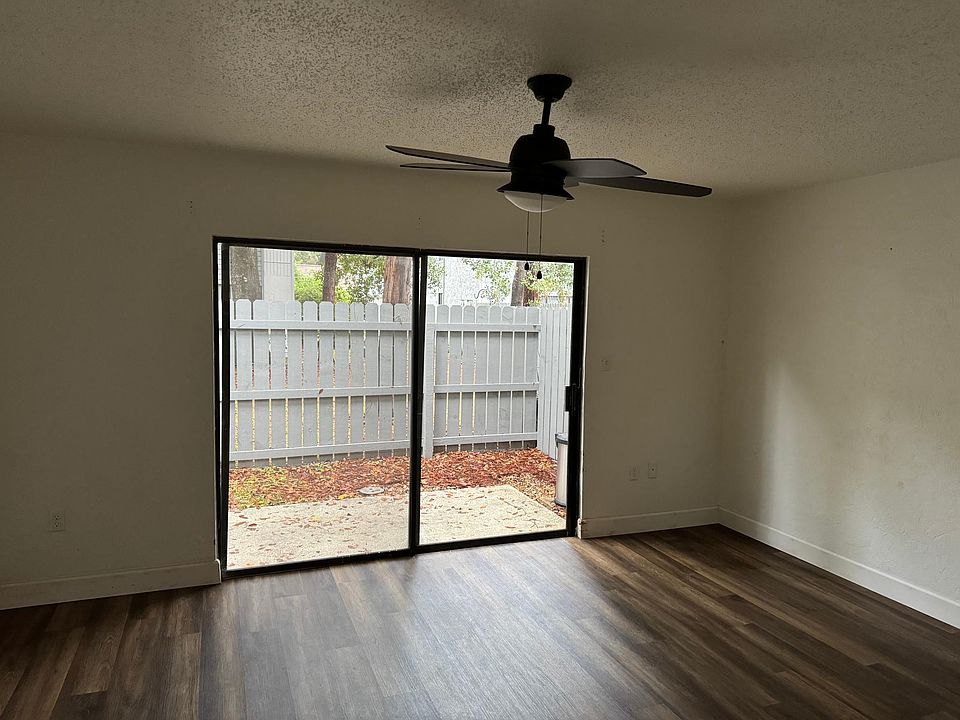 LIVINGROOM WITH FENCED IN SMALL BACKPORCH AREA