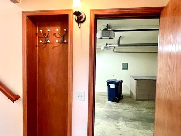 access to garage just inside front door and built in coat rack