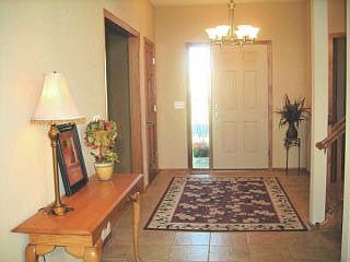Large Ceramic Tiled Foyer.