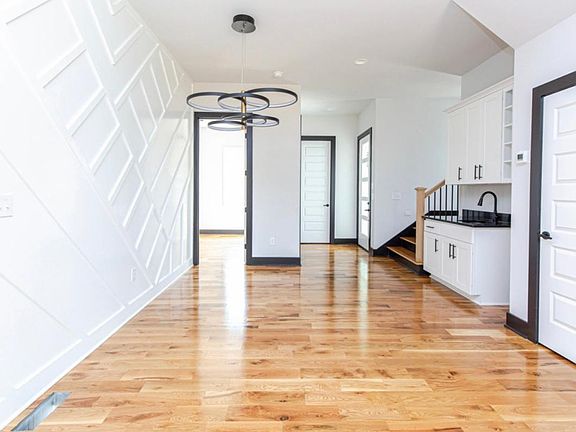 View of wet bar, main half bath, and attached included studio apartment.