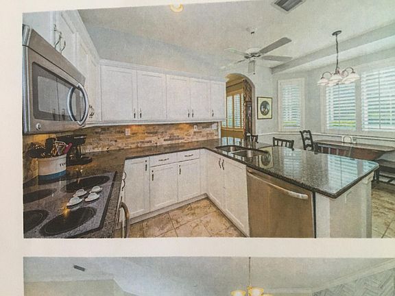 Recently update kitchen with white shaker cabinets, granite counter tops, and all stainless steel appliances