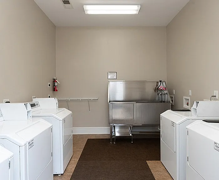 Experience the convenience and comfort of a fully-equipped laundry room, designed for effortless usability.