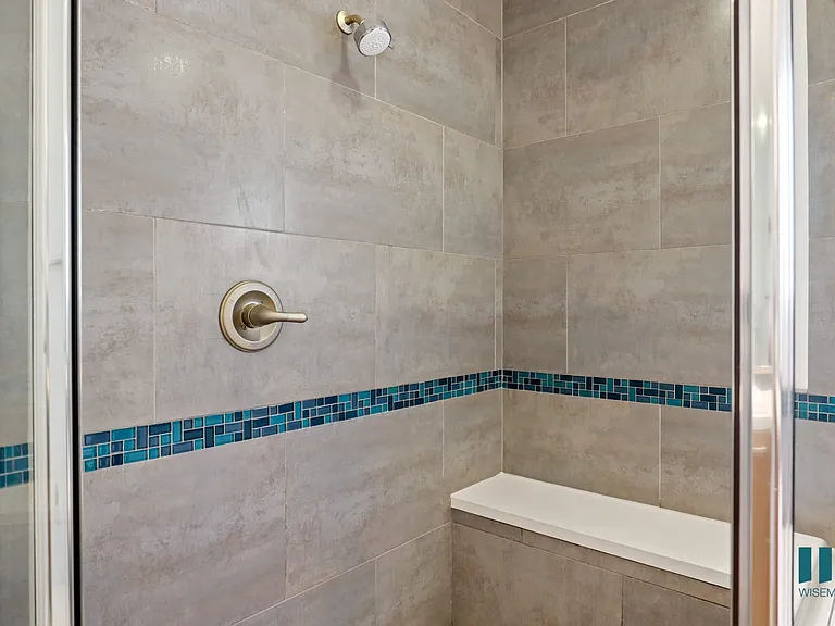 Walk-In Shower with Glass Shower Door and Interior Bench