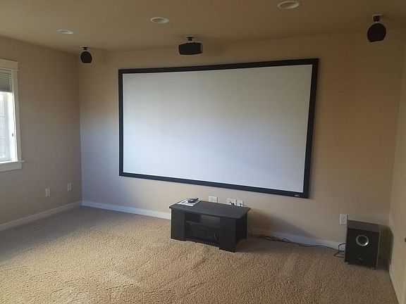 Media room with projector and built in surround sound speake