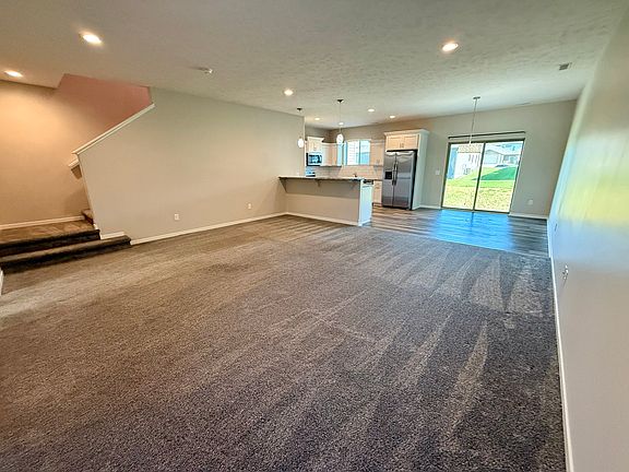 Living, dining, and kitchen view from front door