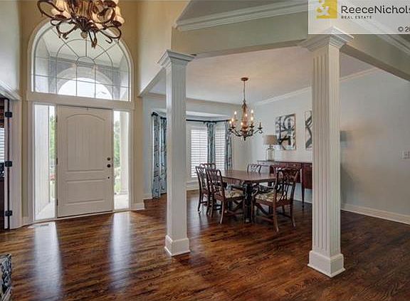 Newly restained hardwoods throughout the home, including the formal Dining Room.