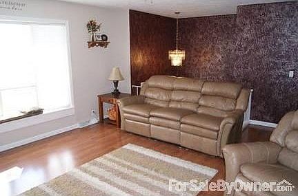 Upstairs Living Room
						:
						Wood Floor, Ceiling Fan & Bay Windows