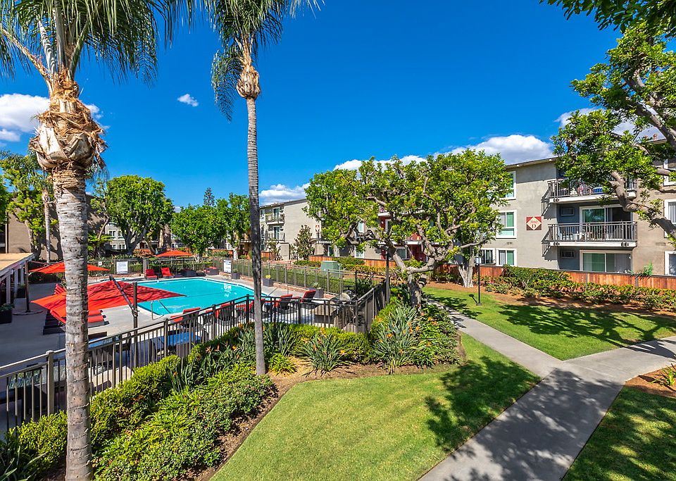 Swimming pool surrounded by lounge chairs.