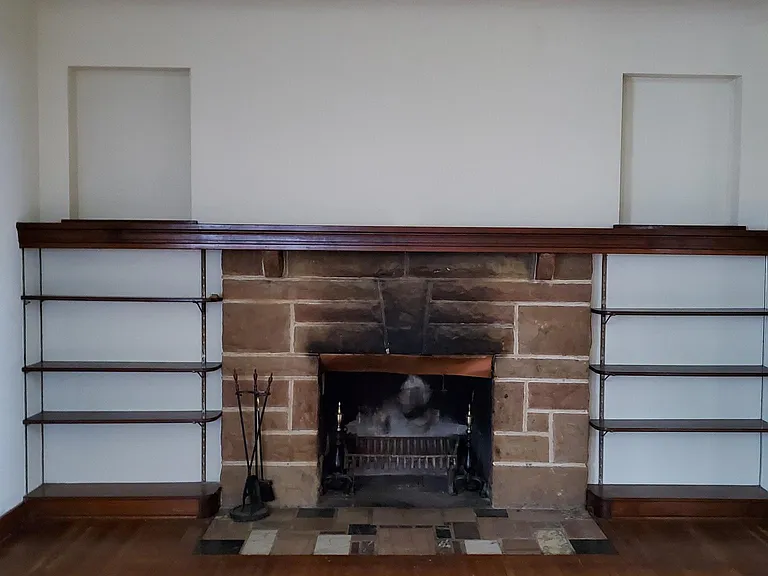 Wood burning fireplace and bookcases